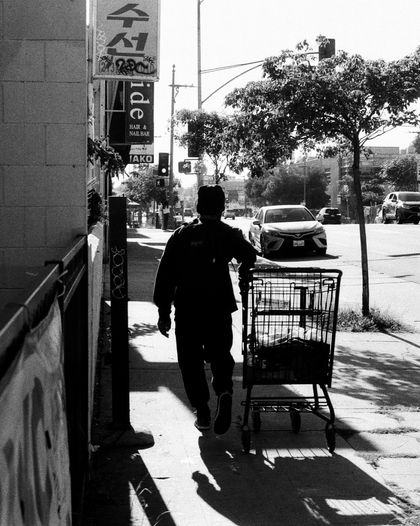 Cart pushed down the sidewalk